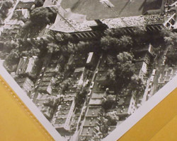 In this later photograph, the houses behind the Fifth Street fence are visible. The house closest to the corner of Fifth and Oakdale has a white roof.